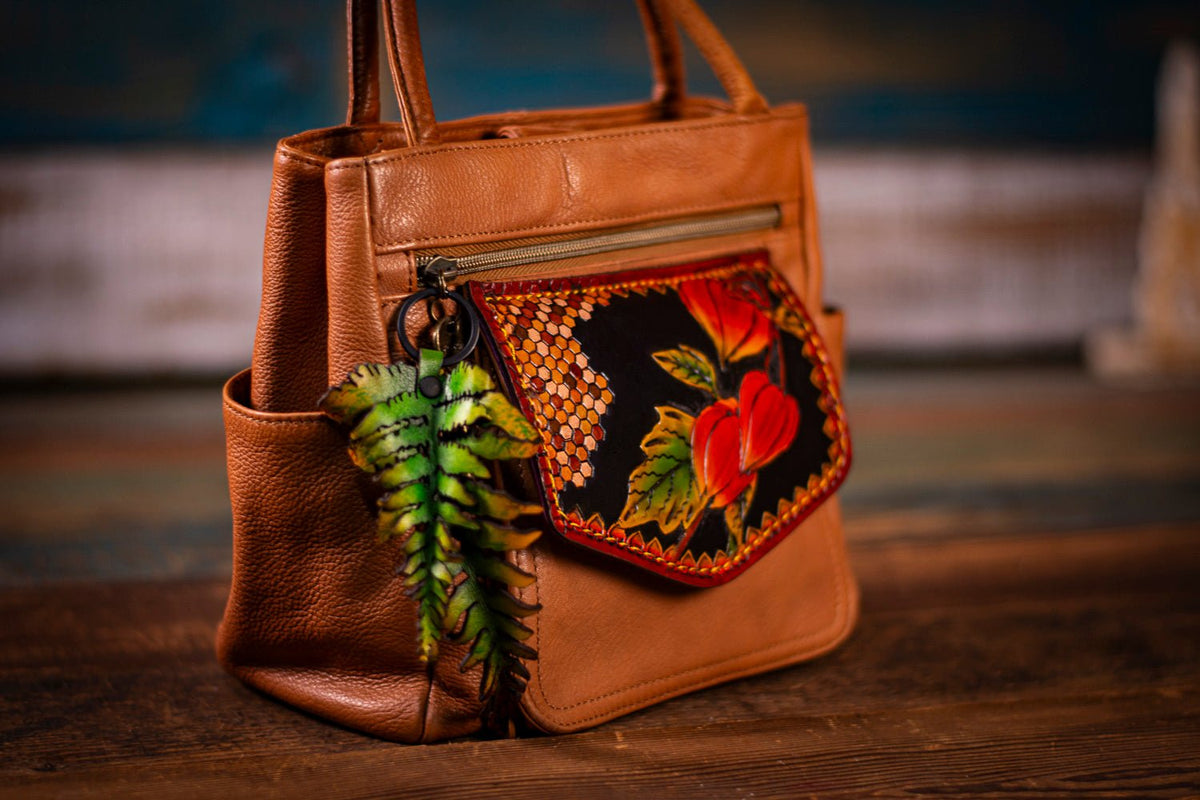 Unique one-of-a-kind shoulder/handbag of goldbrown soft highquality skin/leather with a quilt offers flower decoration