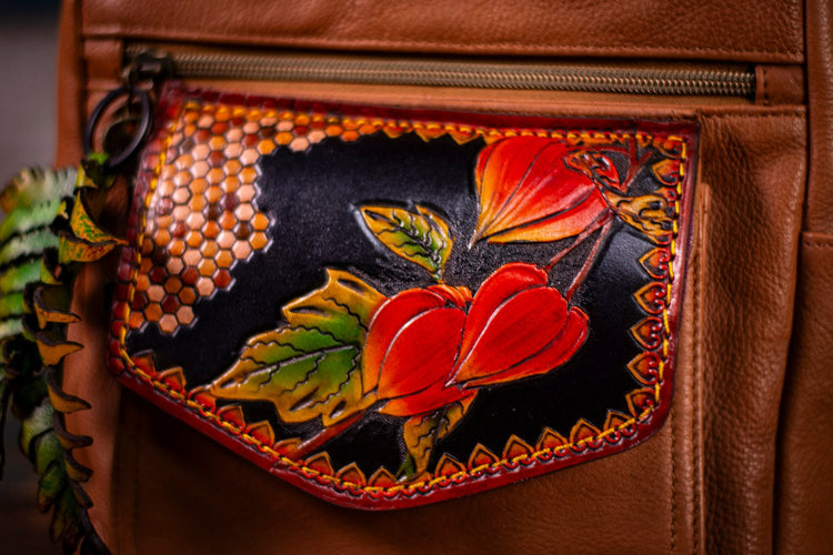 Unique one-of-a-kind shoulder/handbag of goldbrown soft highquality skin/leather with a quilt offers flower decoration