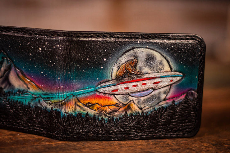 Handcrafted Leather Bifold Wallet - Bigfoot on UFO with Moonlit Mountains and Aurora Borealis - Cryptid and UFO - Inspired Wallet - Lotus Leather