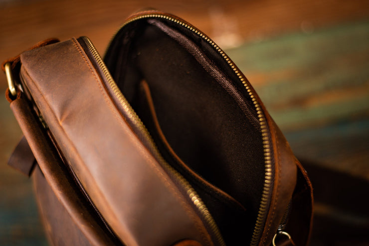 Want that traditional leather look? This dark brown leather is 100% real and made by artisans who love what they do as much as you will love this messenger bag. Customizations are available - make it your own today!